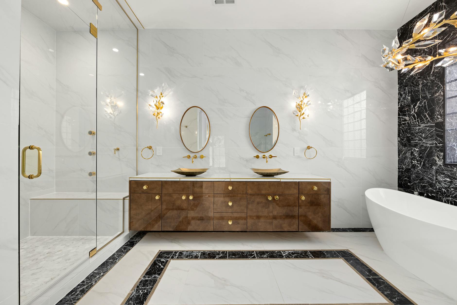 luxurious bathroom with marble and gold accents