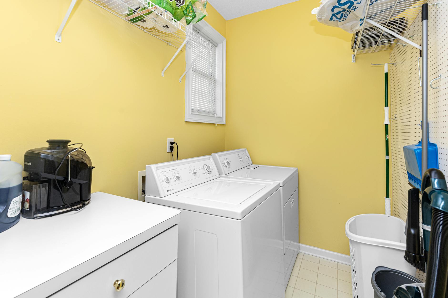 organized laundry room with baskets