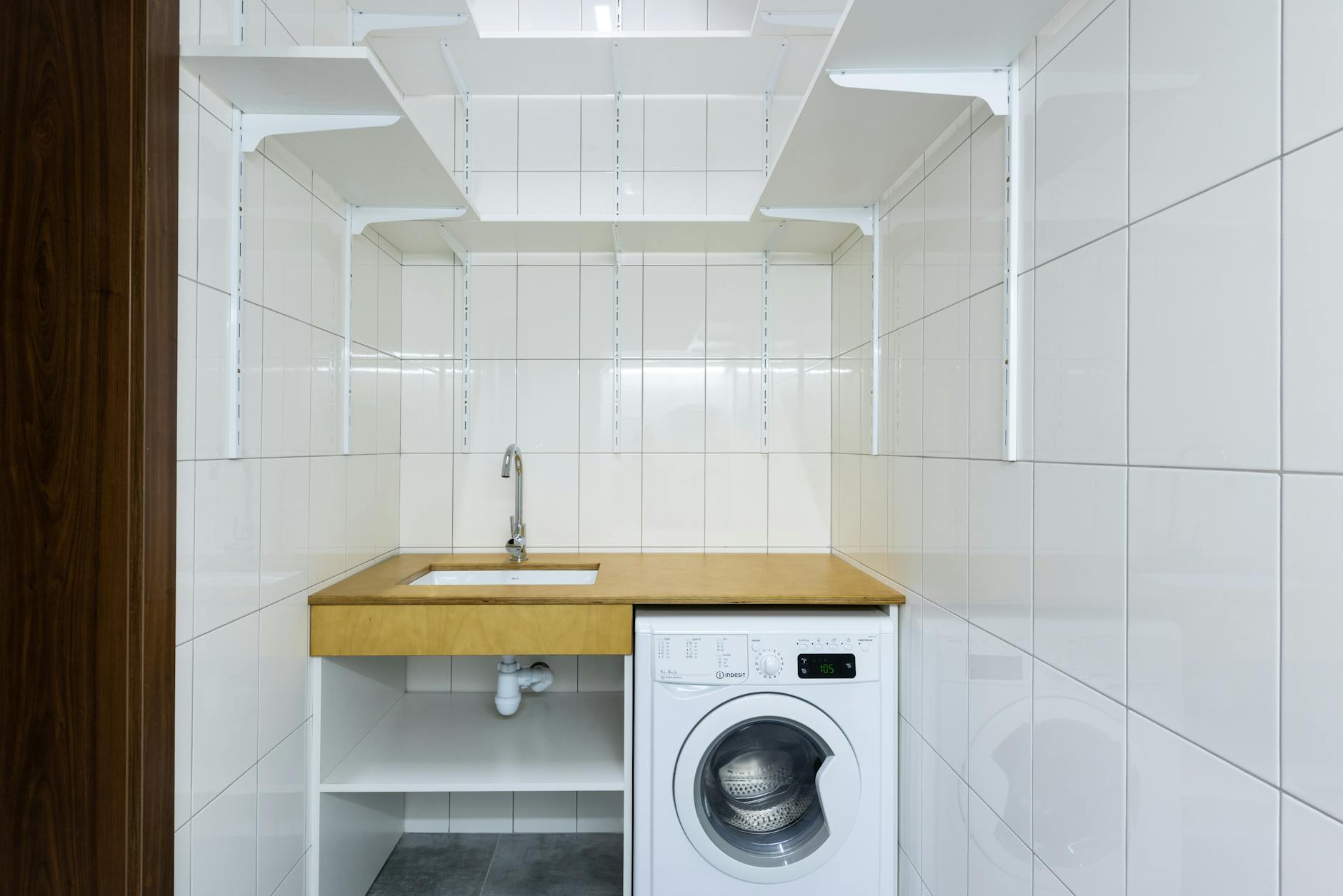 organized laundry room with tools