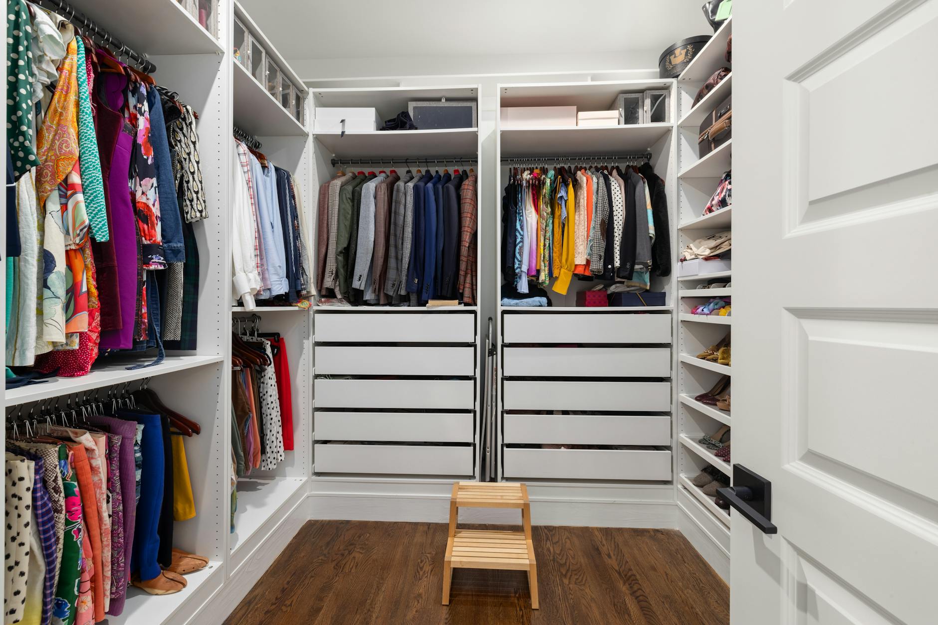 organized closet with clothes neatly arranged