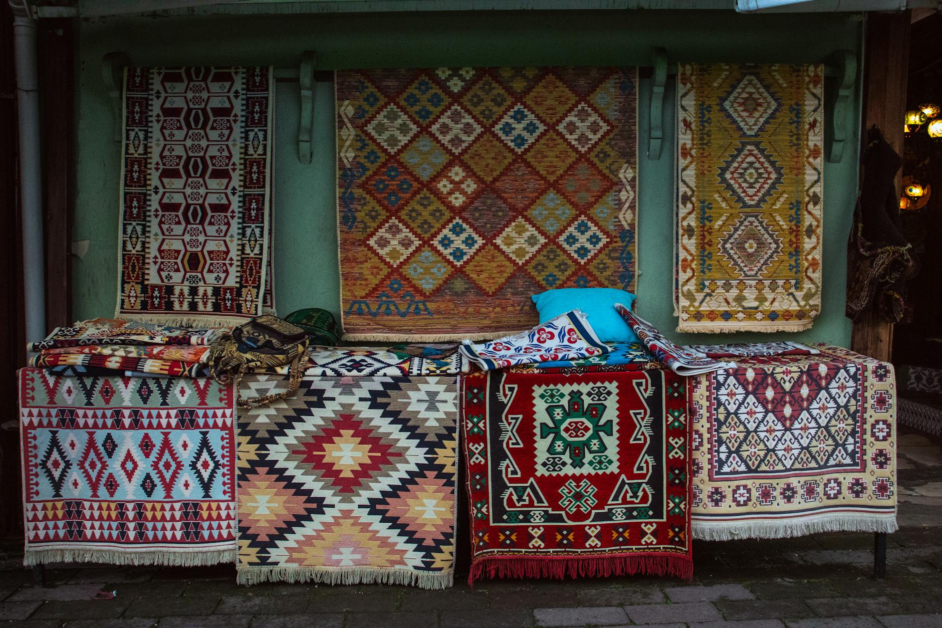 layered textiles in entryway with rug and bench