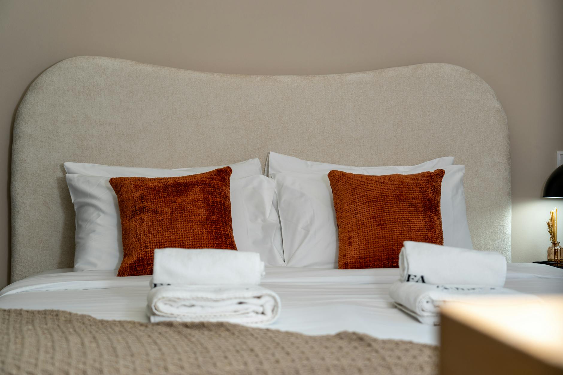 luxurious hotel bed with plush pillows and elegant bedding