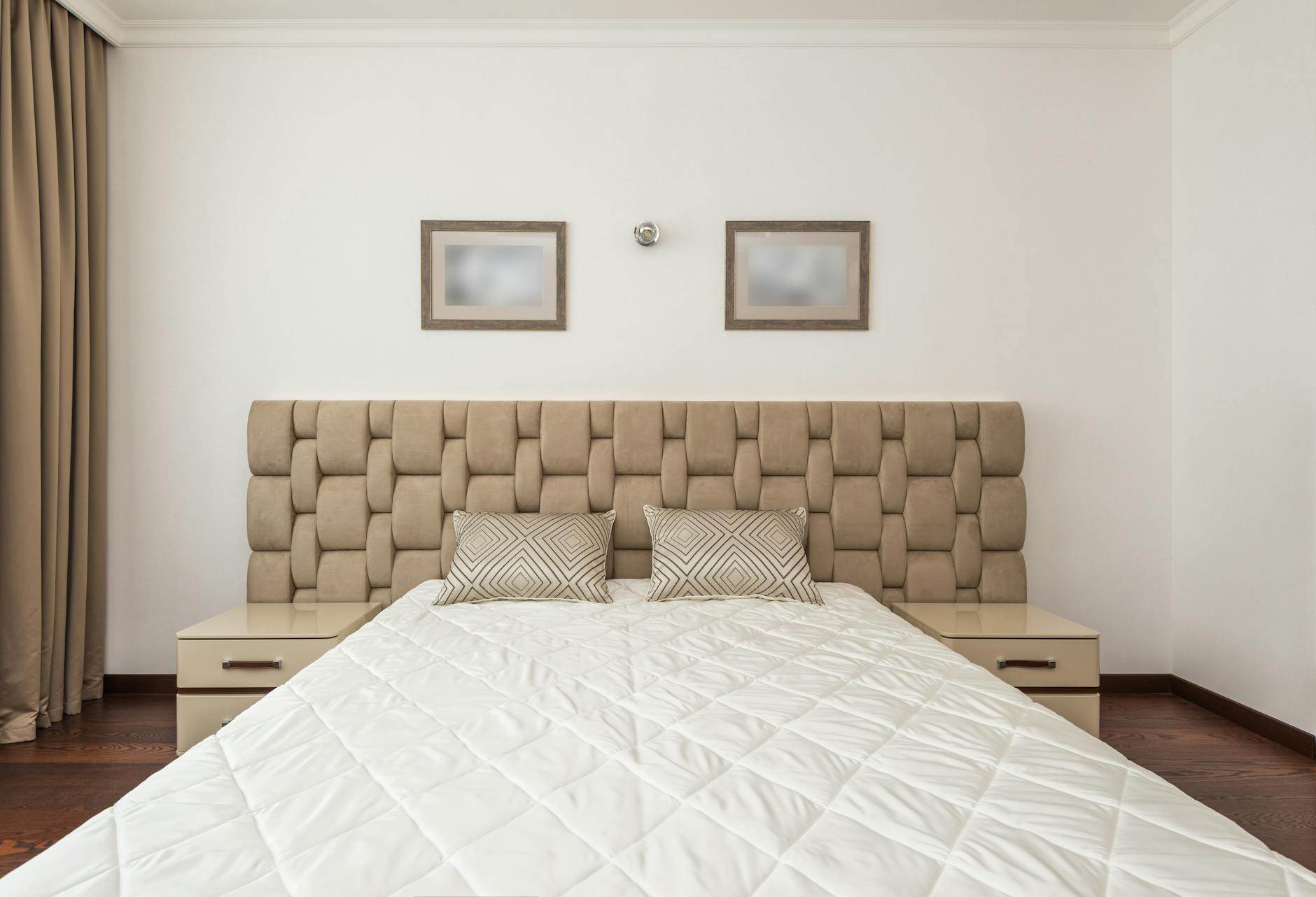 neatly organized bedroom with luxurious bed linens