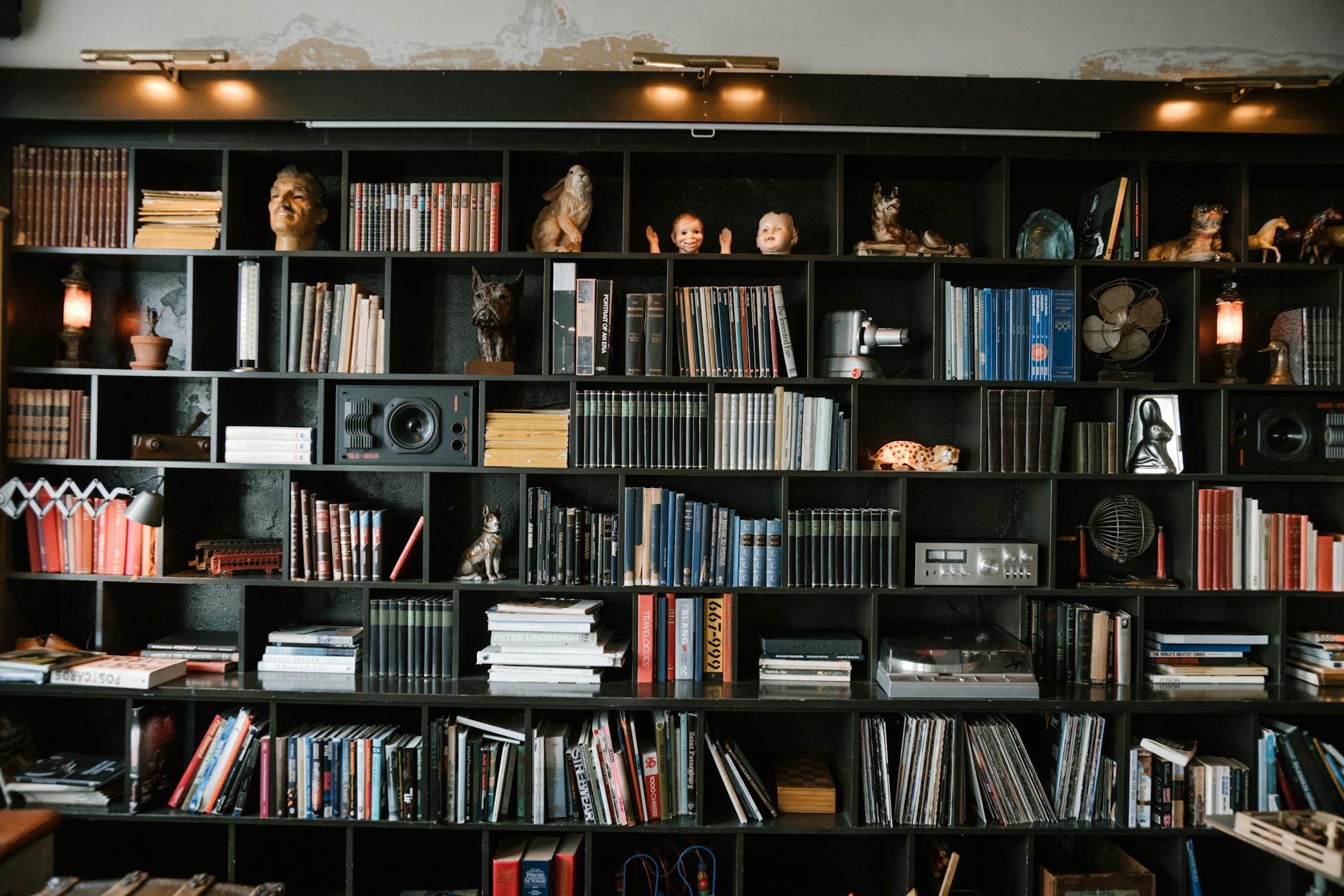 shelf styled with personal artifacts and books