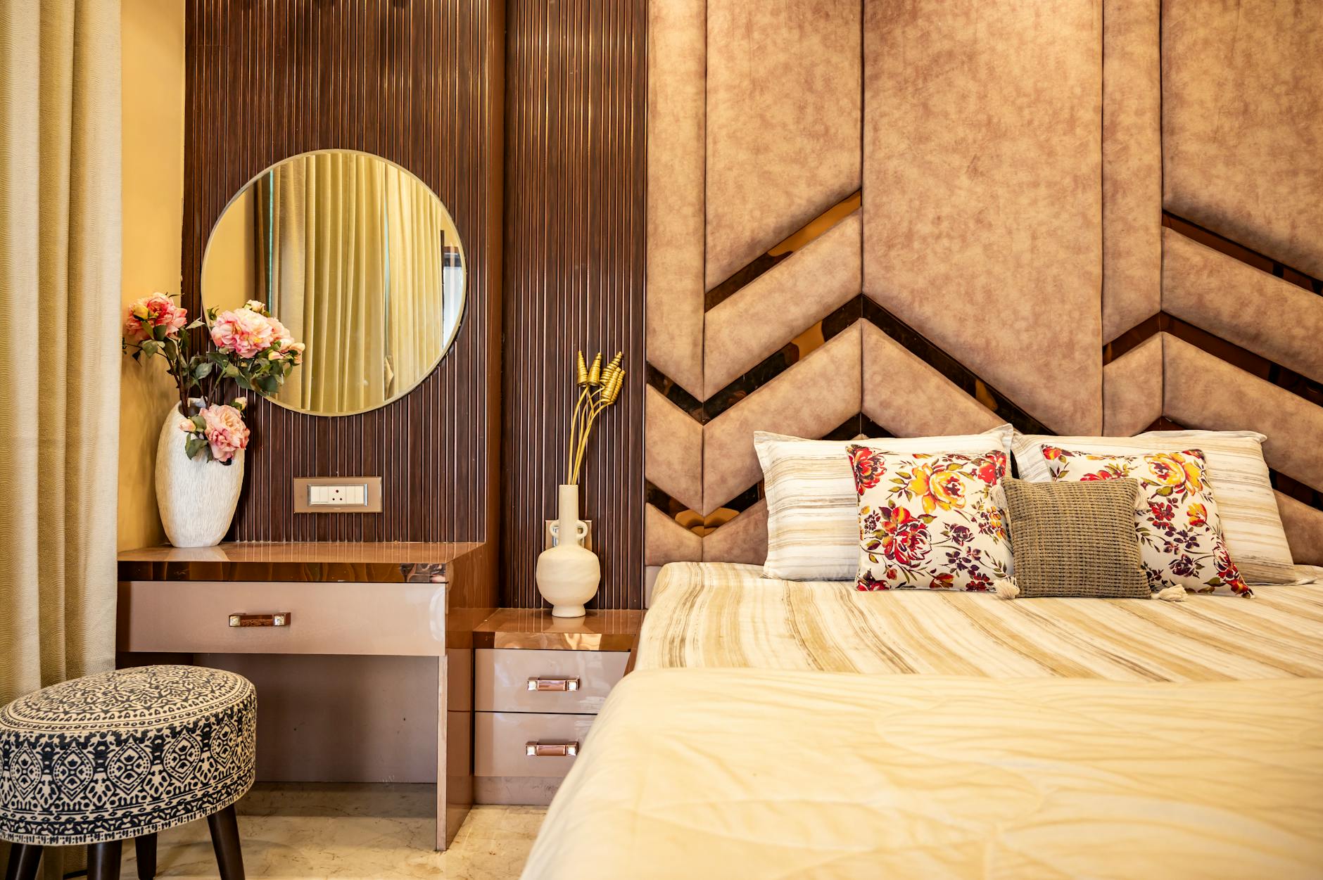 bedroom with warm lighting and earth-toned accessories