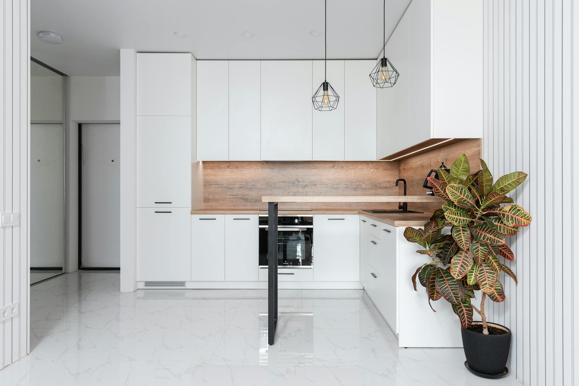 modern kitchen with wooden cabinets and plants