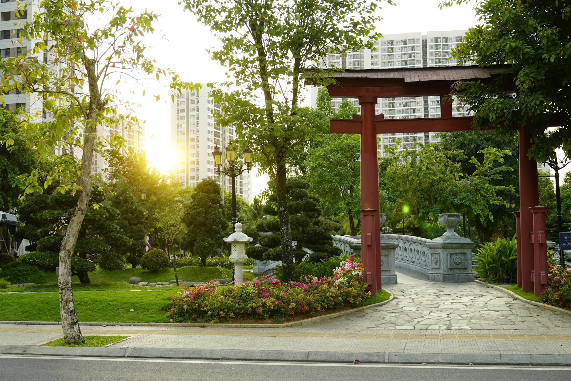 a tranquil hidden garden in a busy city, lush greenery surrounded by tall buildings