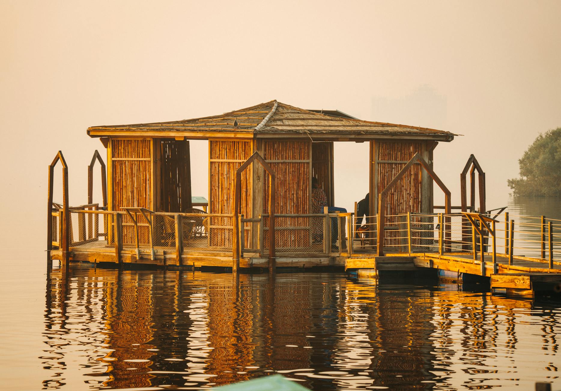 sunrise over floating house water