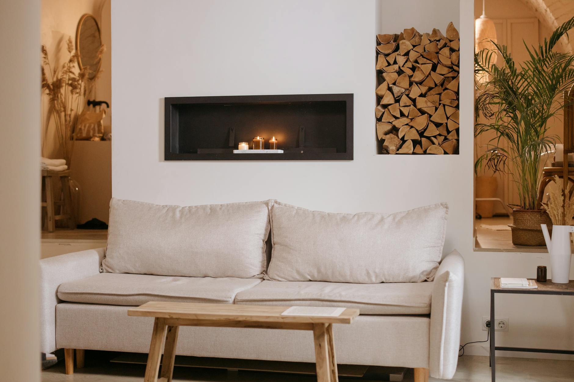 Cozy neutral living room with beige sofa and light wood accents