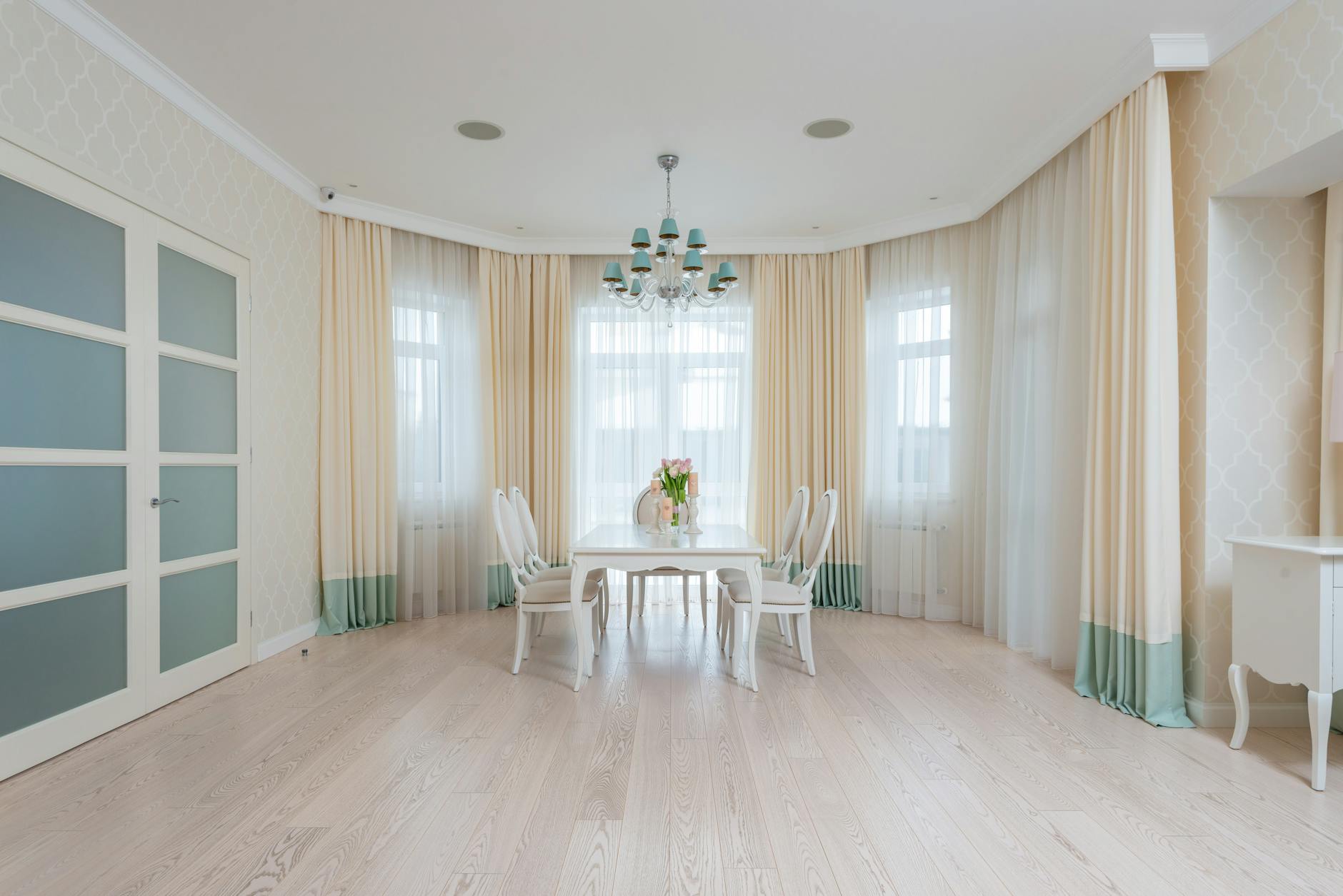elegant dining room with large windows and chic curtains