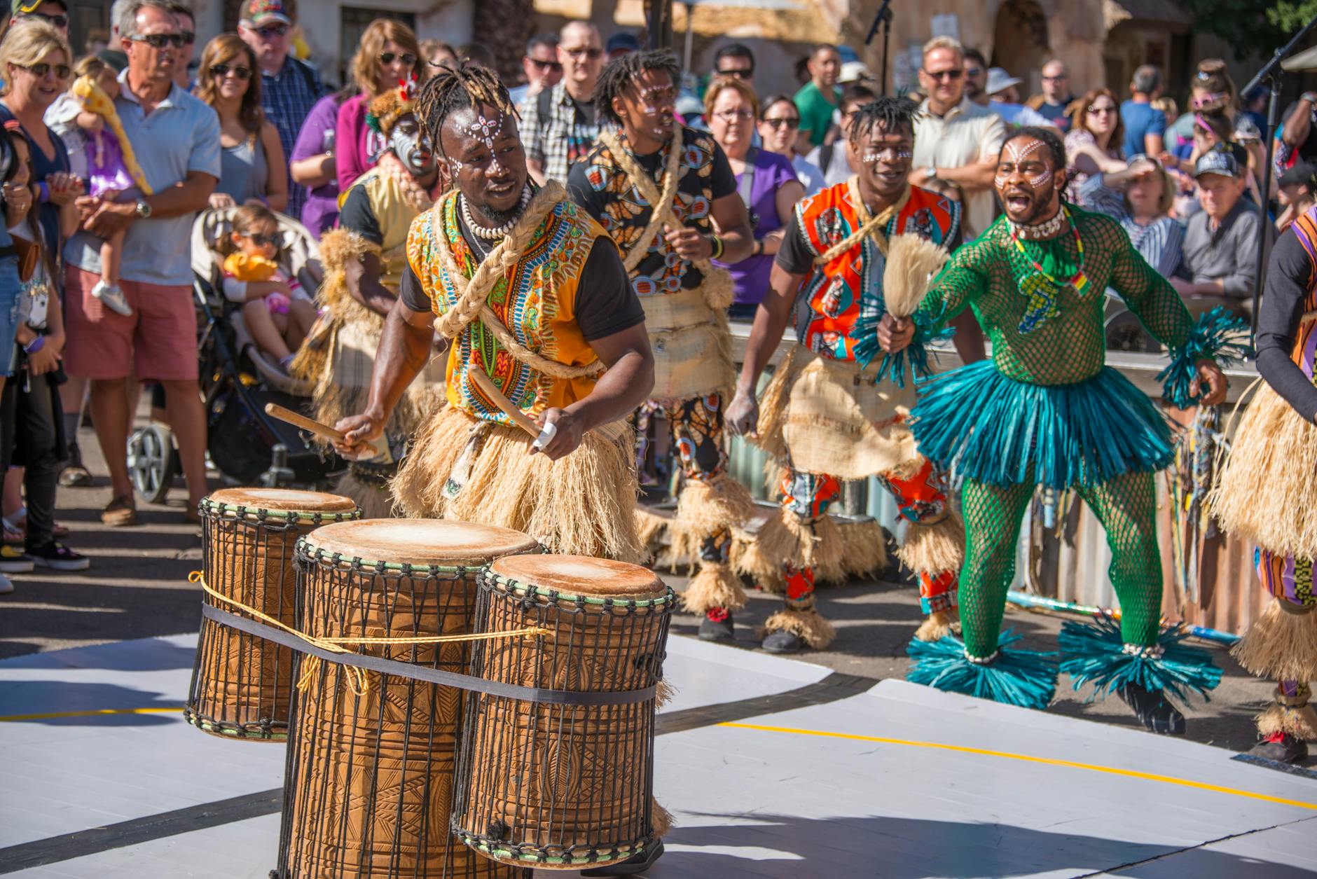 Community festival with street performers and diverse audience