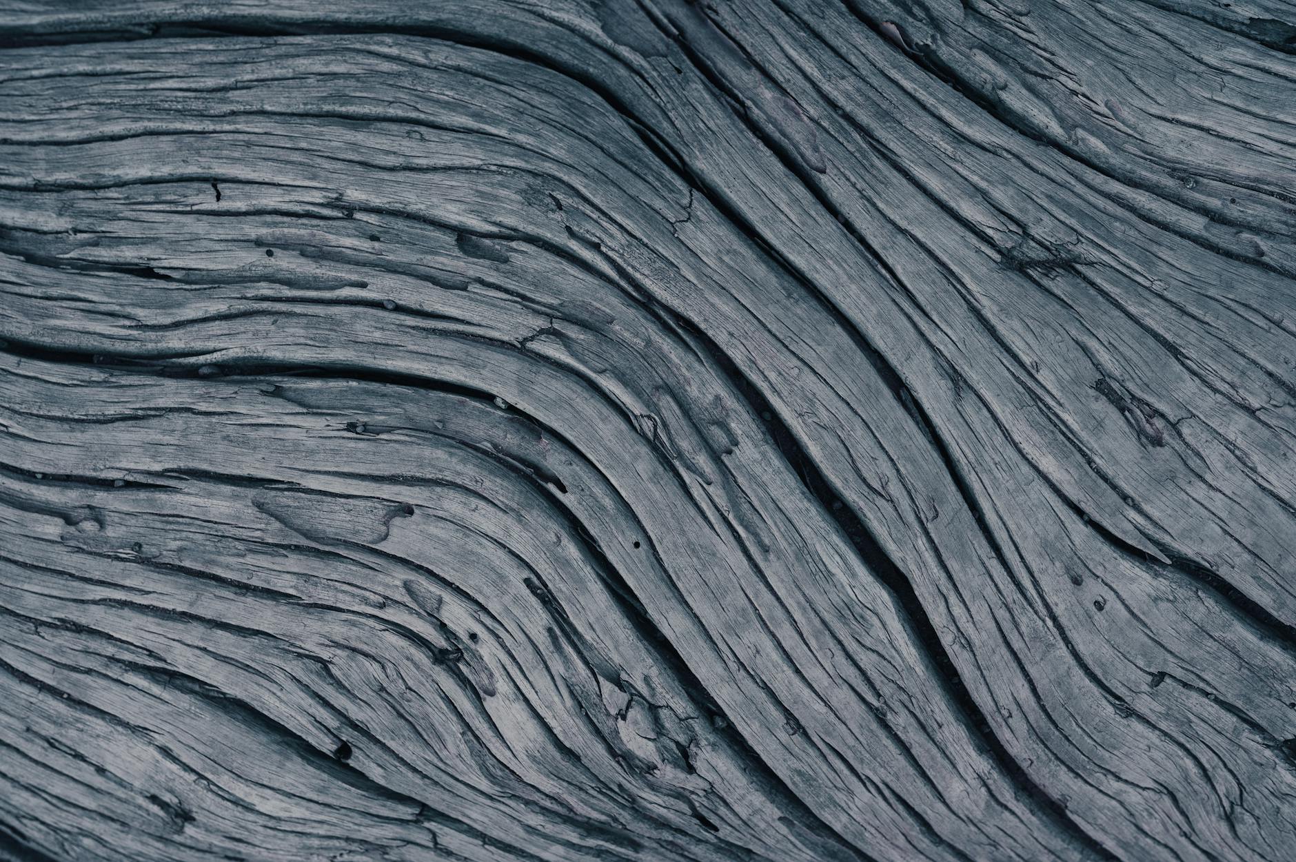 close-up of organic textures like rough wood and soft linen