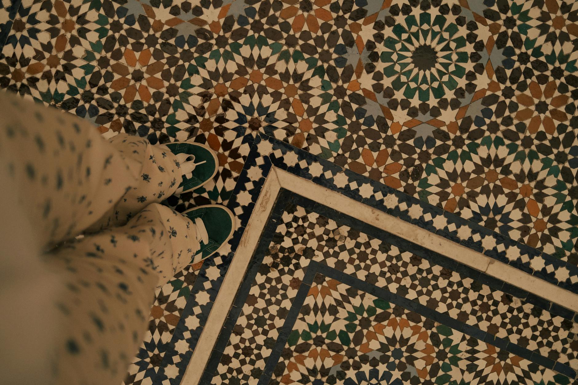 mosaic floor with colorful tiles and whimsical patterns