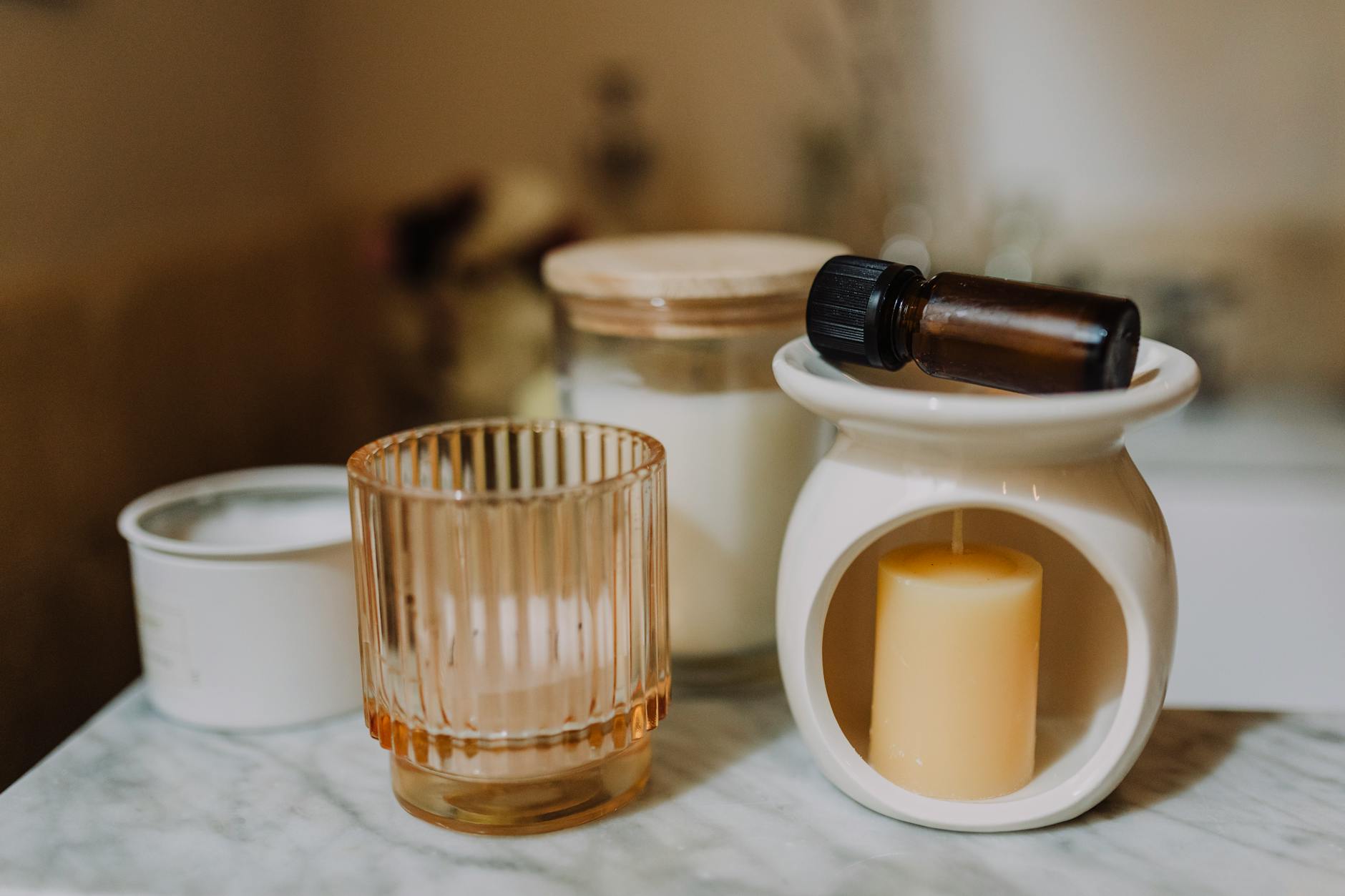 aromatherapy diffuser and candles in a bedroom