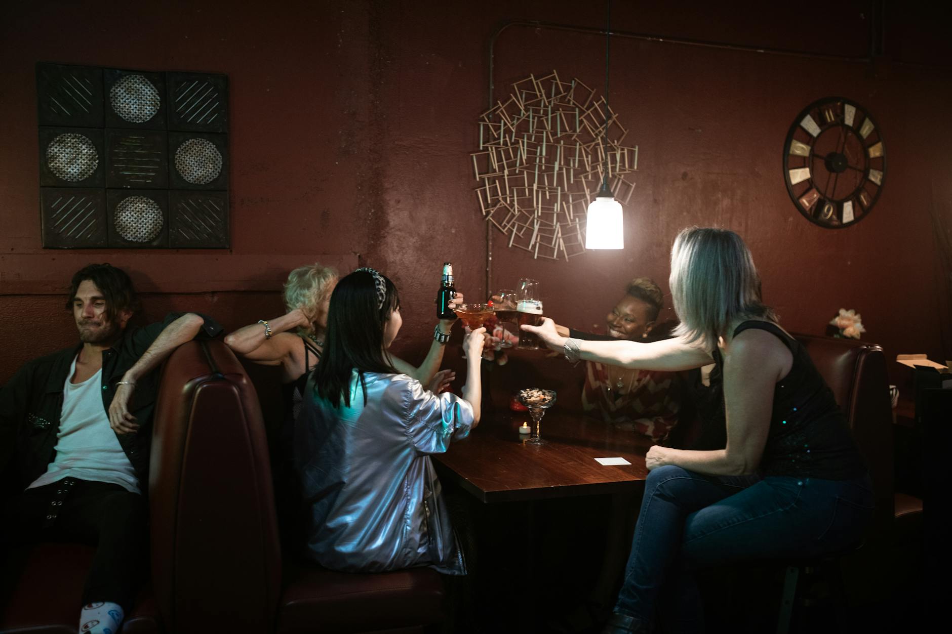 People enjoying drinks and music at a bar on Main Street at night