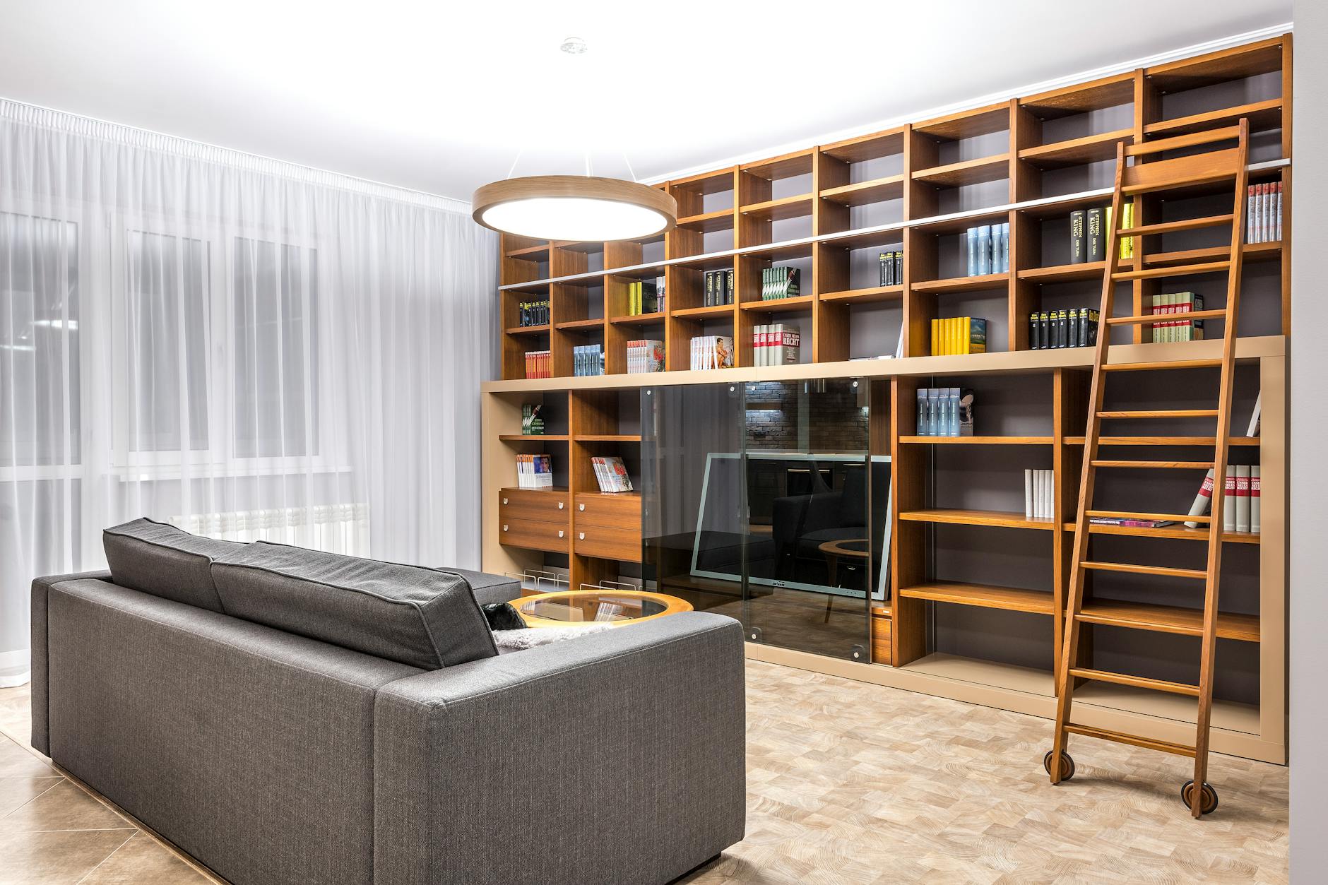 tall bookcases in high ceiling living room