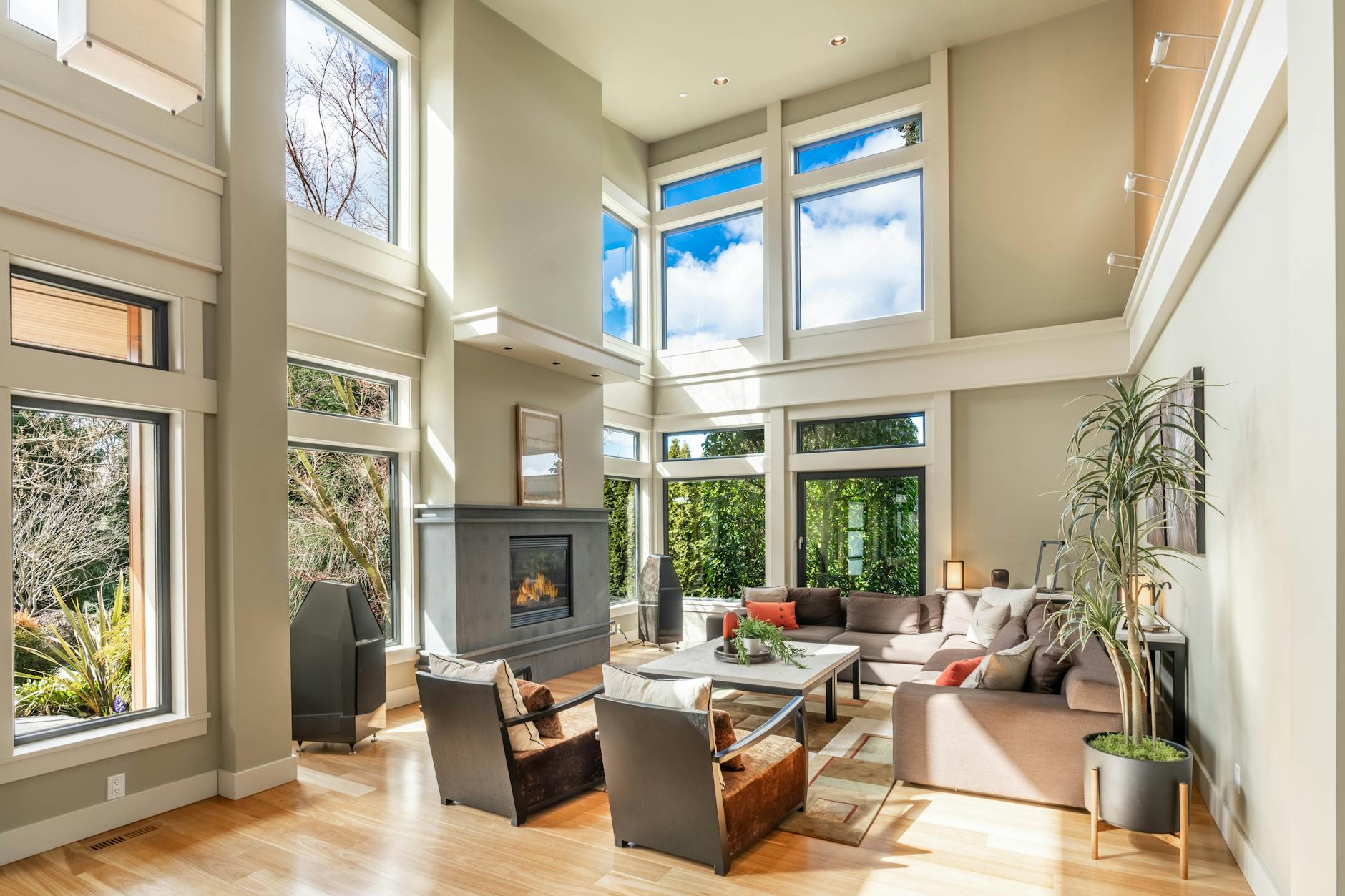 high ceiling room with large windows and architecture