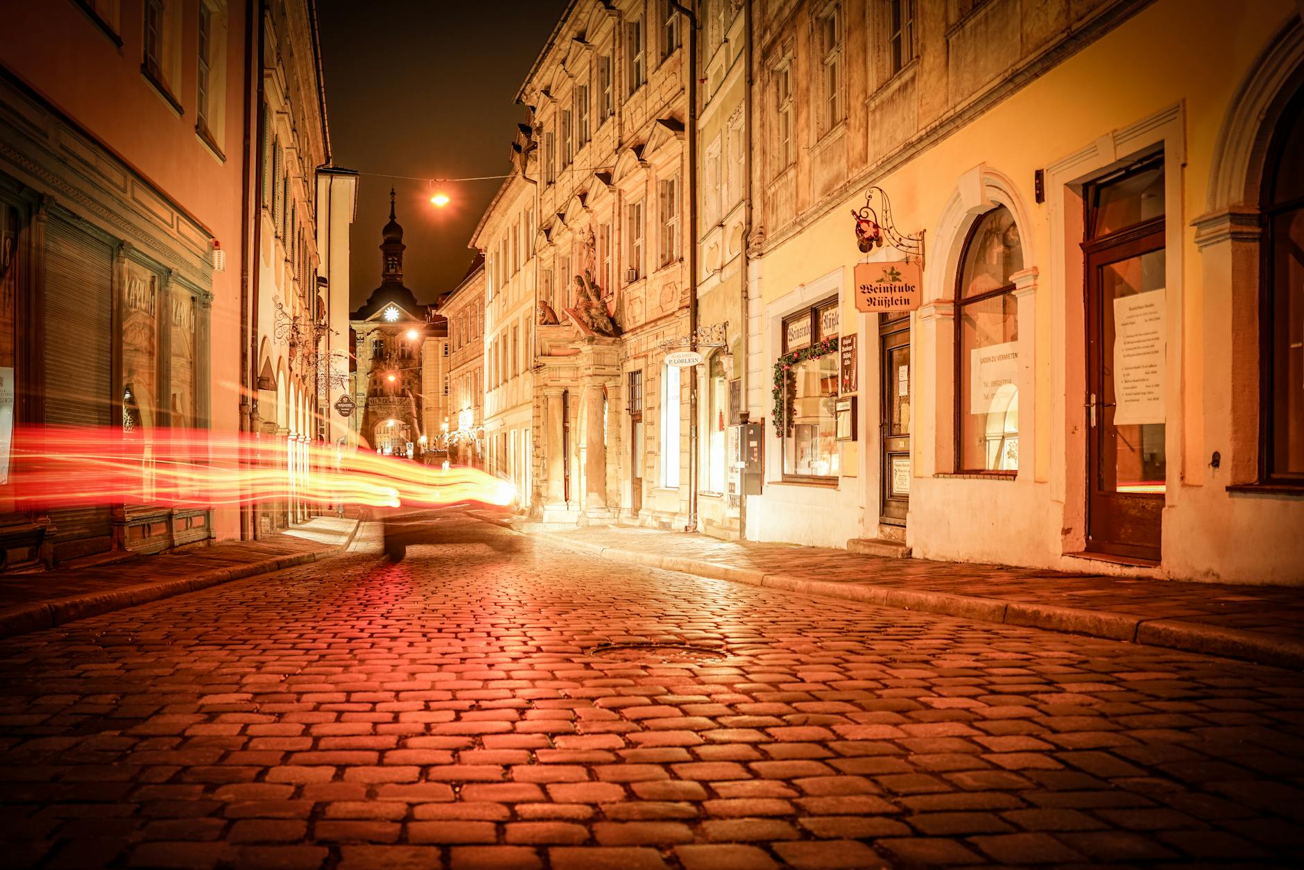 historic town at night with cobblestone streets